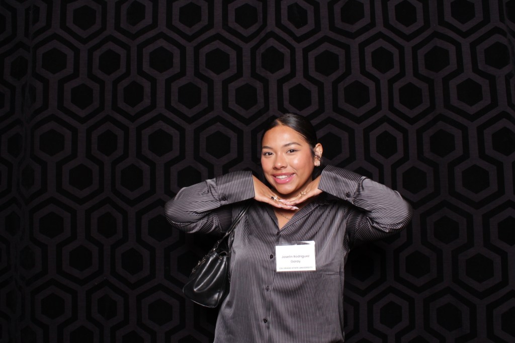 Woman strikes a pose for photo booth