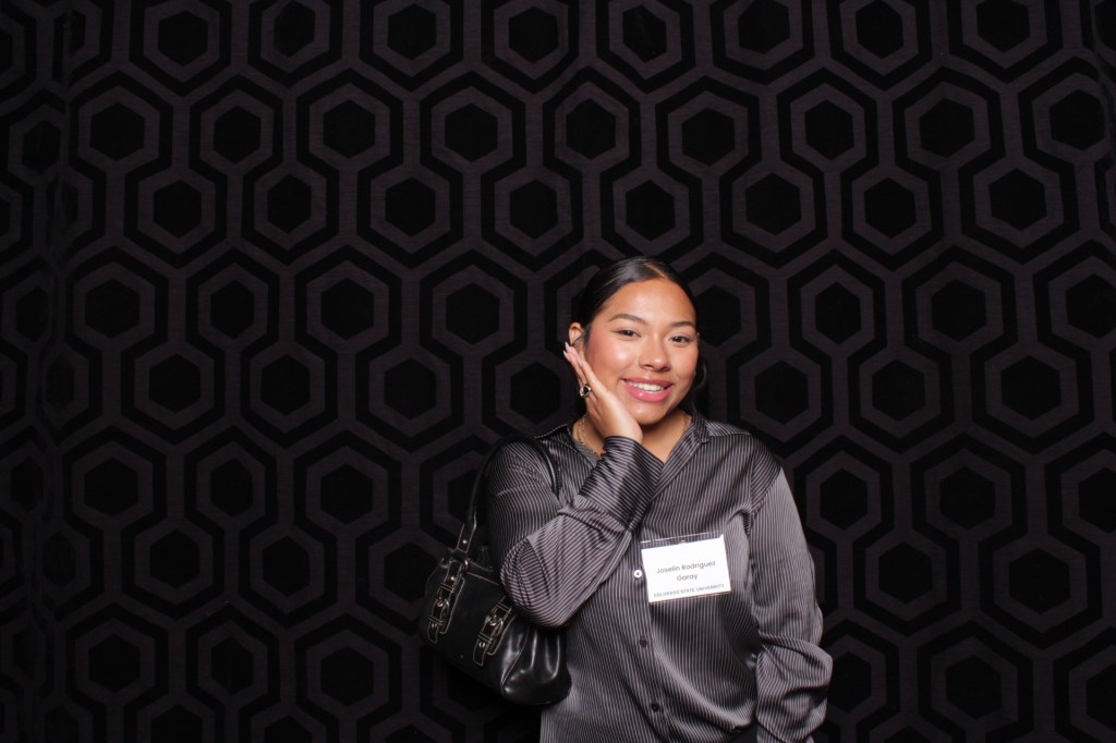 Woman strikes a pose for photo booth
