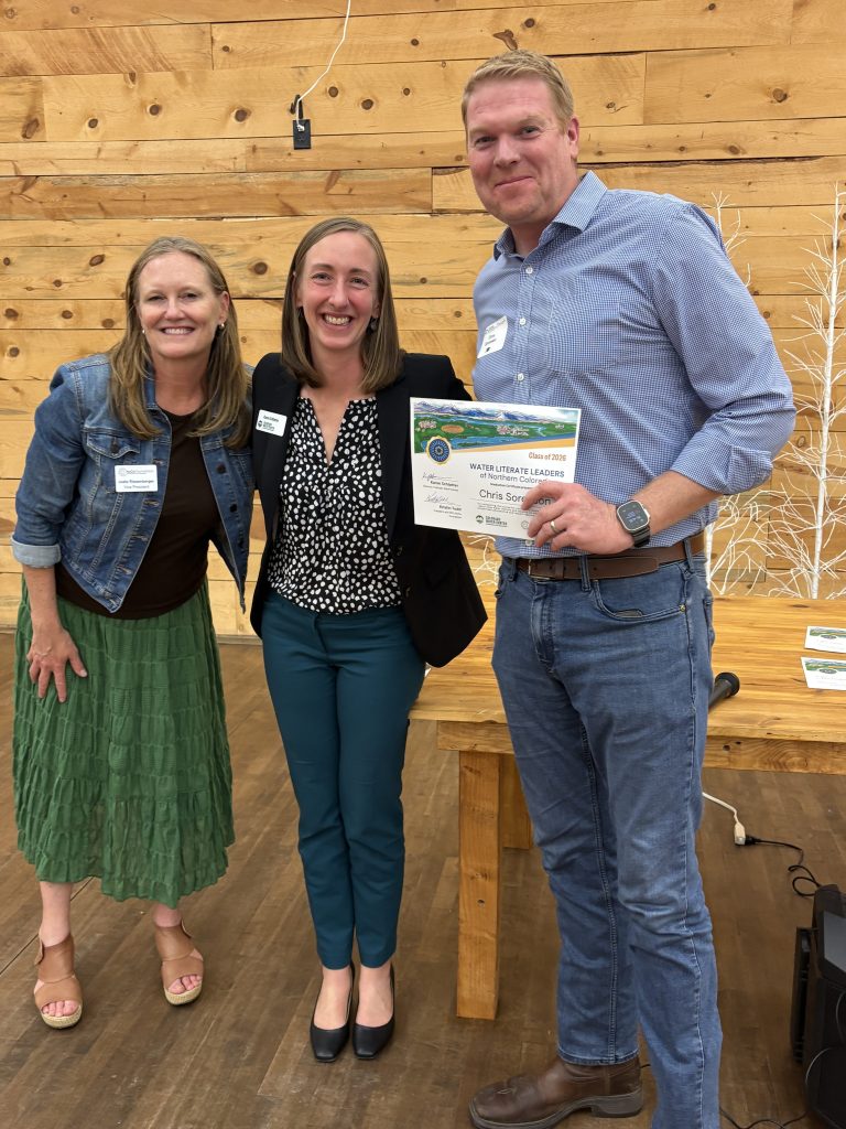 Karen Schlatter poses with NoCo Foundation representative and Water Literate Leaders graduate