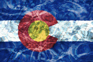 Colorado flag graphic under water